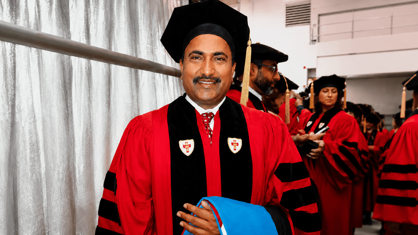 Dr. Vijay Kumar in doctoral regalia at Boston University