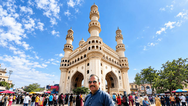 Charminar monument in Hyderabad with four minarets and surrounding Old City street life